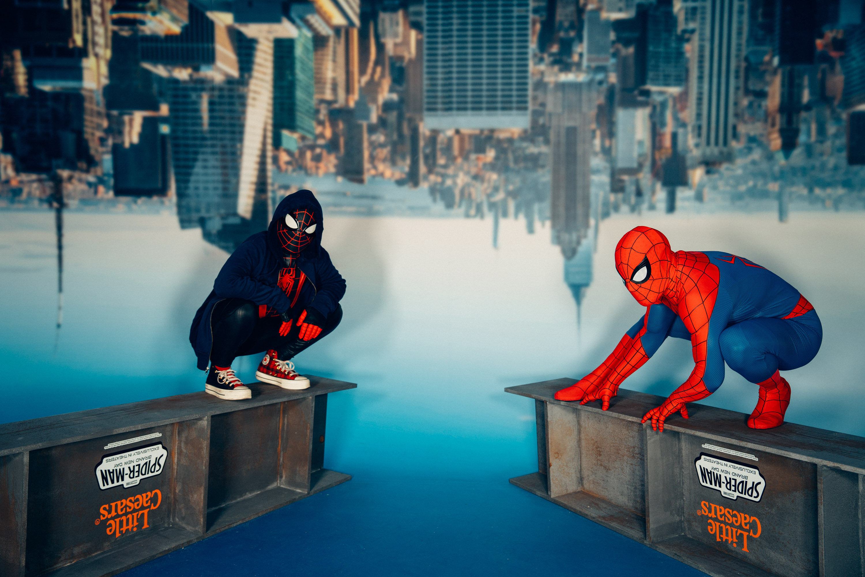 Upside-down New York skyline photo op with two Spider-Men